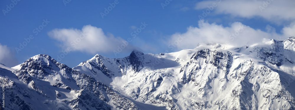 Snowy mountains and glacier at sunny day