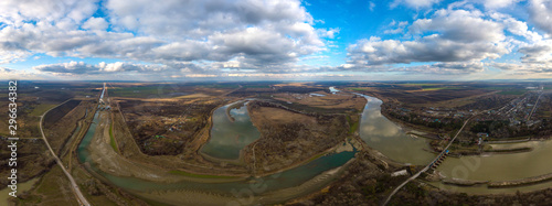 large panorama of the distribution waterworks for irrigation of rice fields on the Kuban River and the irrigation canal, which has become shallow in winter, near the village of Fedorovskaya in souther photo