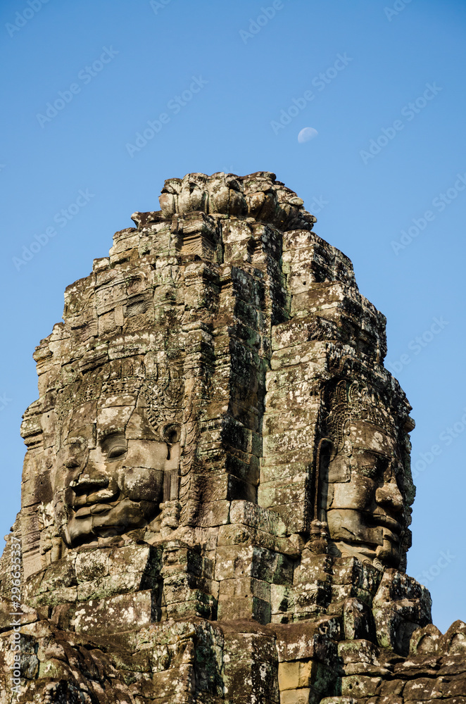 Ancient stone faces of Asian culture, in abandoned temples - Angkor Wat
