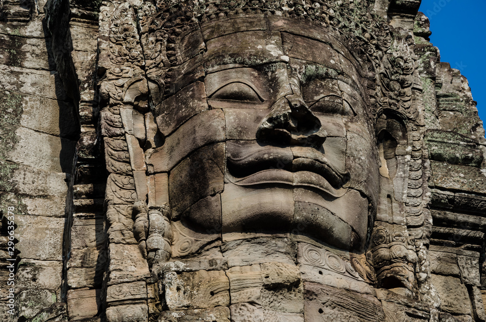 Ancient stone faces of Asian culture, in abandoned temples - Angkor Wat