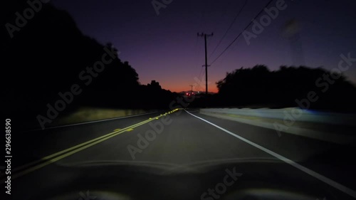 Dawn driving view towards Stoney Point on Santa Susana Pass Road in Los Angeles, California. 