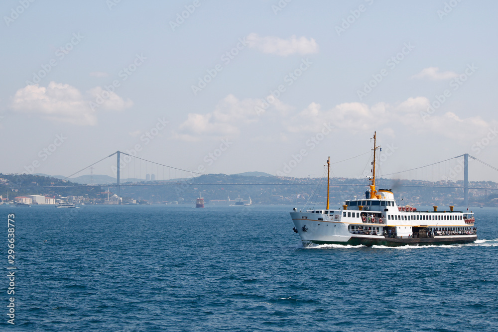 Fototapeta premium View of Istanbul's ferry and Bosphorus bridge in the background.