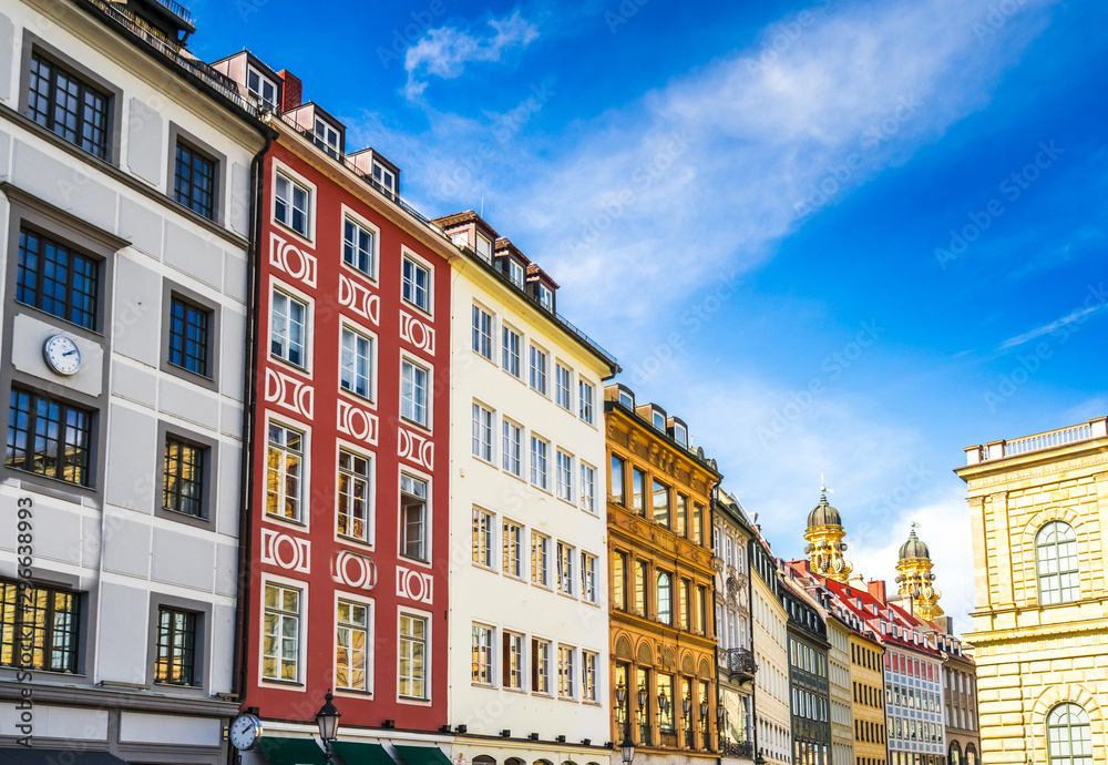 Fototapeta premium View on old houses in downtown Munich with theatiner Church in the back, Germany