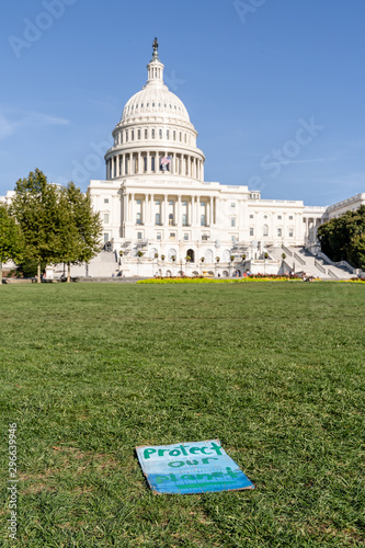 Climate change protest sign in front of the United States Capital Building in Washington D.C.