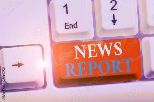 Writing note showing News Report. Business concept for spoken or written account of something that one has observed White pc keyboard with note paper above the white background photo