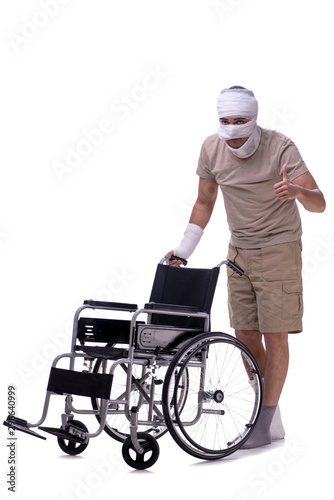 Injured man in wheel-chair isolated on white
