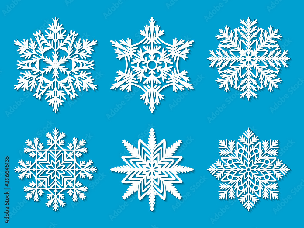 Set of six white paper cut out highly detailed snowflakes on blue background. Vector illustration