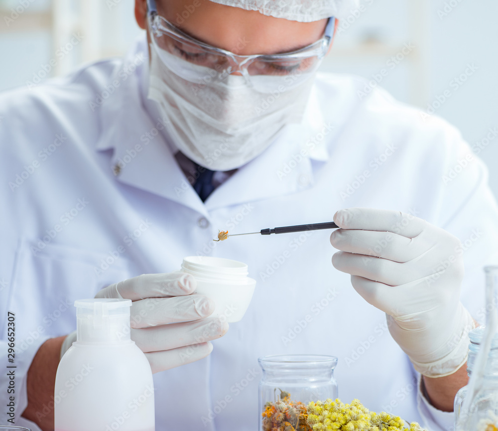 Chemist mixing perfumes in the lab