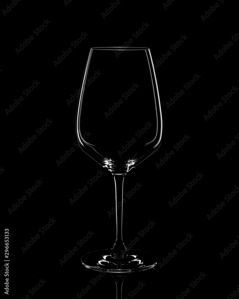 Silhouette of red wine glass on black background