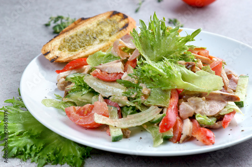 salad with chicken, tomatoes and bruschetta