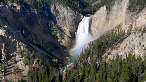 wide view of a rainbow at lower yellowstone falls
