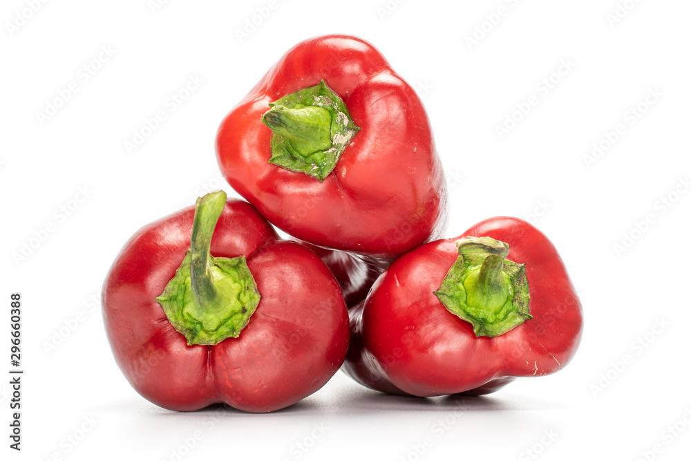 Group of three whole sweet red bell pepper isolated on white background Group of three whole sweet red bell pepper isolated on white background