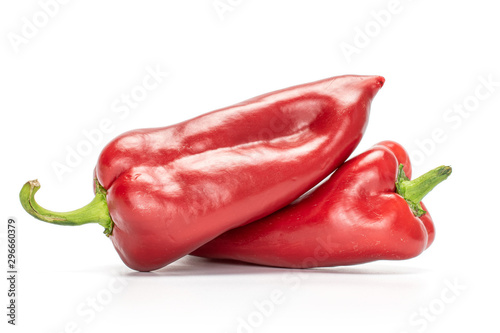 Group of two whole sweet red bell pepper isolated on white background