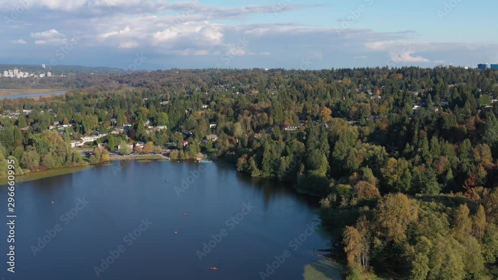 Aerial View at Mountain Lake with Blue Sky in British Columbia, Canada. 4K. Aerial View at Mountain Lake with Blue Sky in British Columbia, Canada. 4K.