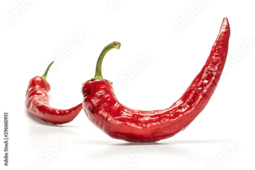 Group of two whole fresh hot pepper isolated on white background