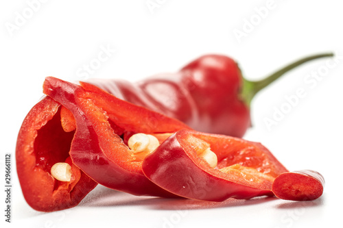 Group of one half two slices of fresh hot pepper isolated on white background photo