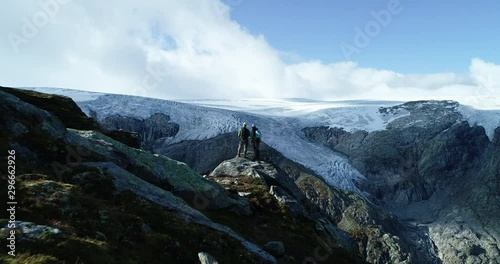 Epic drone footage of a copule watching Folgefonna glacial in Norway. photo