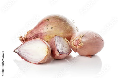 Group of two whole two halves of fresh brown shallot isolated on white background