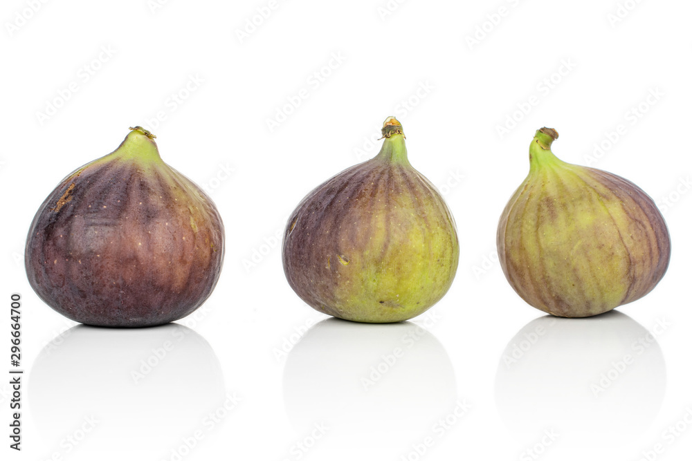 Group of three whole sweet purple fig isolated on white background Group of three whole sweet purple fig isolated on white background