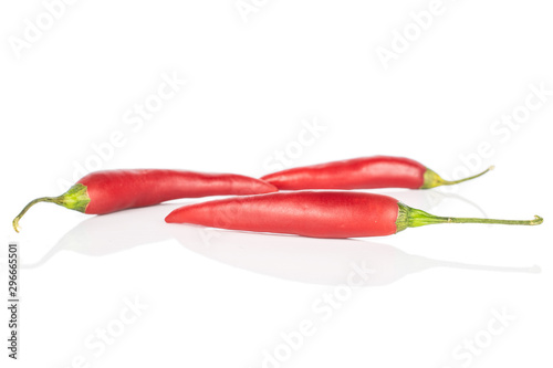 Group of three whole hot red chili cayenne isolated on white background © PIXbank