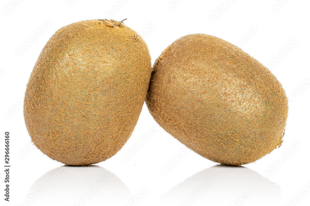 Fototapeta premium Group of two whole exotic brown kiwi isolated on white background