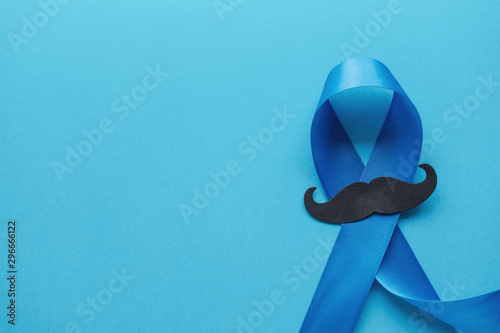 Light blue ribbons with mustache on blue background , Prostate Cancer Awareness, Movember Men health awareness,International Men's Day