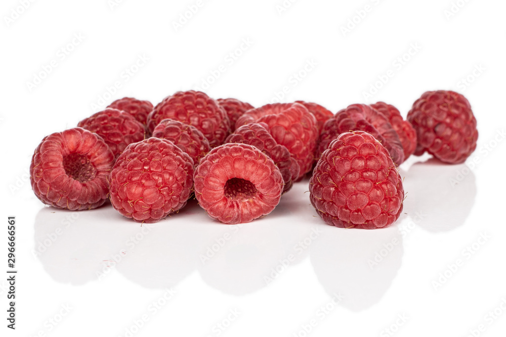 Lot of whole disordered fresh red raspberry isolated on white background Lot of whole disordered fresh red raspberry isolated on white background