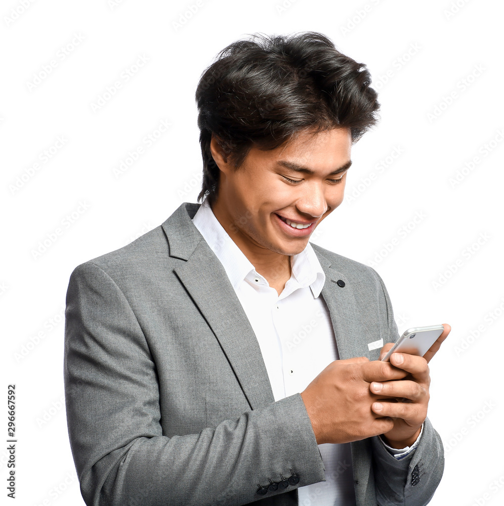 Portrait of handsome Asian businessman with phone on white background Portrait of handsome Asian businessman with phone on white background