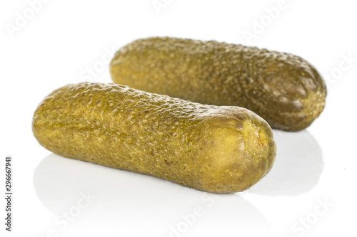 Group of two whole sour green pickle isolated on white background
