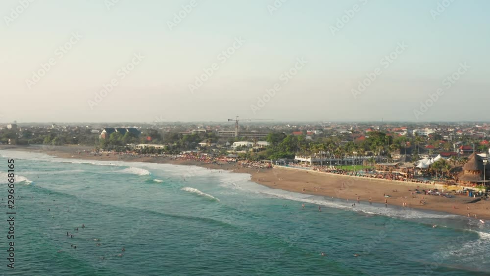 The beaches of Canggu during sunset. With beach clubs, hotels, resorts, restaurants and surfers. Aerial shot. The beaches of Canggu during sunset. With beach clubs, hotels, resorts, restaurants and surfers. Aerial shot.