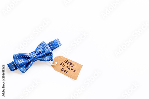 Father's Day concept with bow tie on white background top view copy space photo