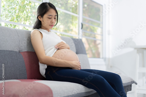 Free Download Pregnant woman resting in her house - GFXLoad