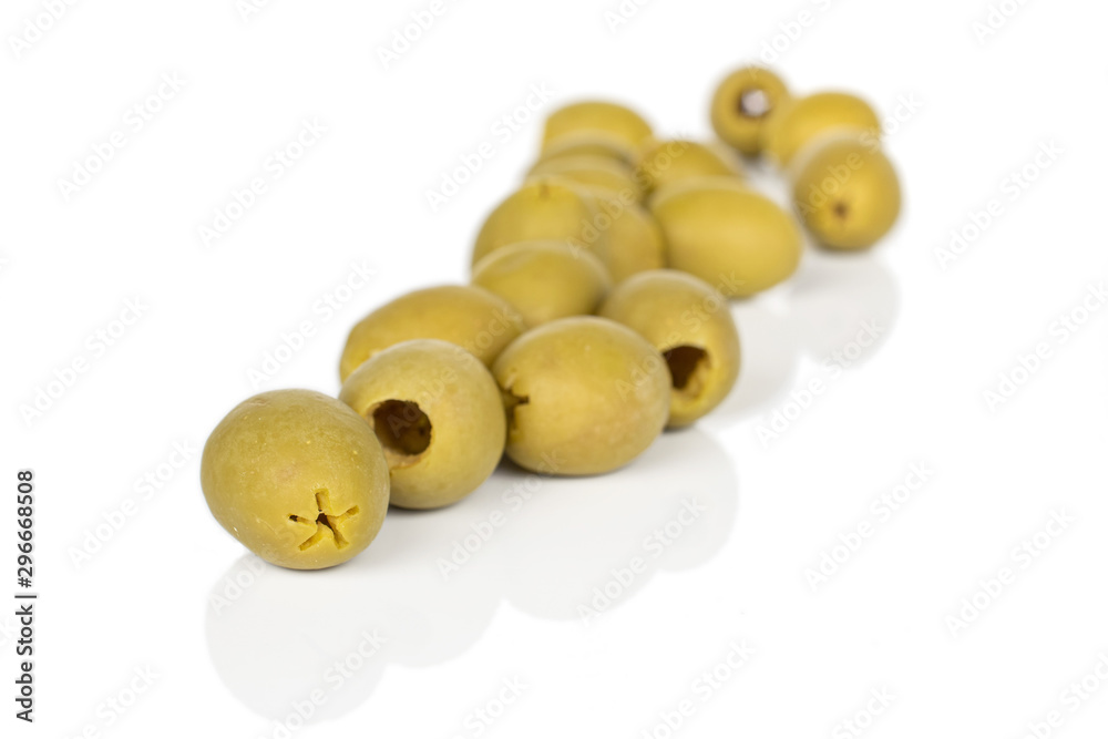 Lot of whole marinated green olive front focus isolated on white background Lot of whole marinated green olive front focus isolated on white background