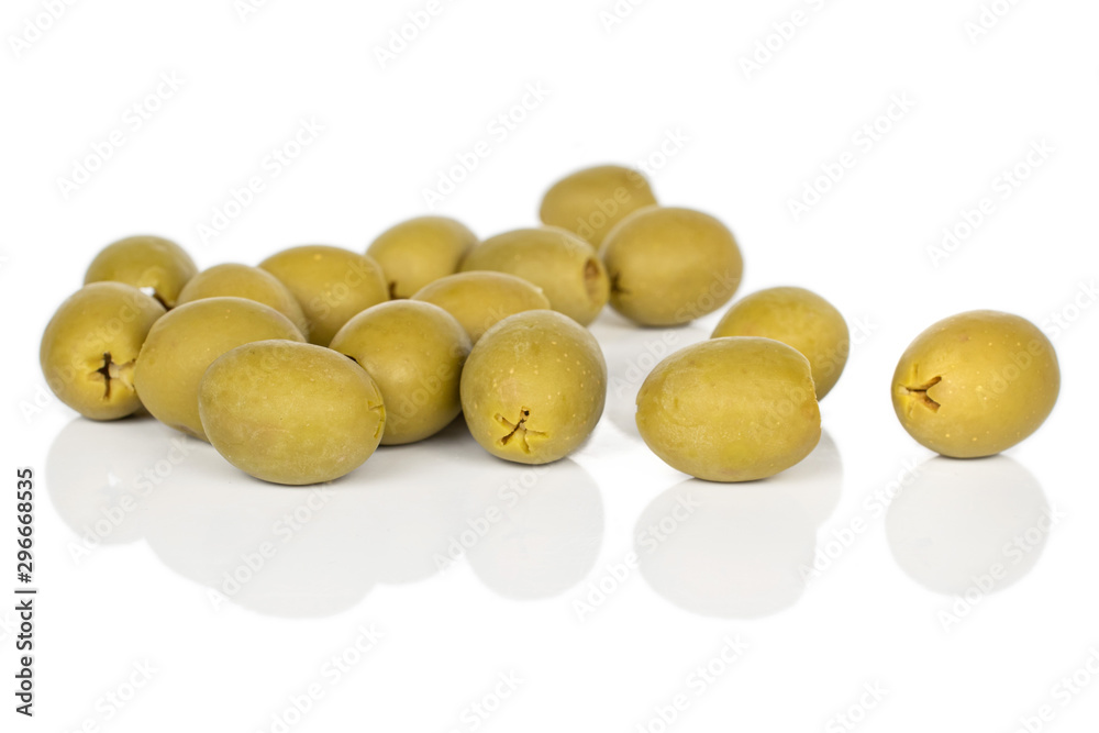 Lot of whole disordered marinated green olive isolated on white background Lot of whole disordered marinated green olive isolated on white background