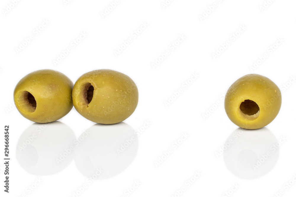 Group of three whole marinated green olive isolated on white background Group of three whole marinated green olive isolated on white background