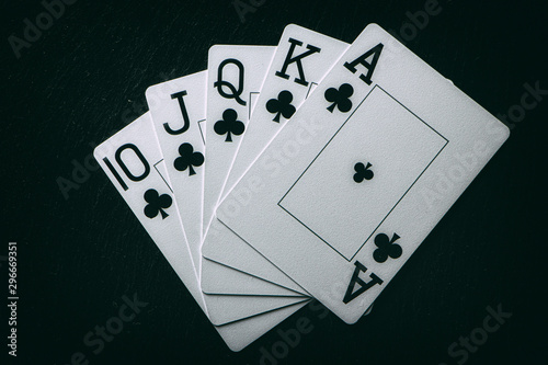 Royal Flush on a black background, a very rare poker hand