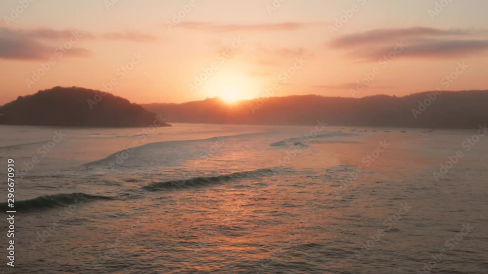 Sunrise at the surf spots of Gerupuk in Lombok, with a view on the bay with the fishing boats and surfers. Aerial shot. Sunrise at the surf spots of Gerupuk in Lombok, with a view on the bay with the fishing boats and surfers. Aerial shot.