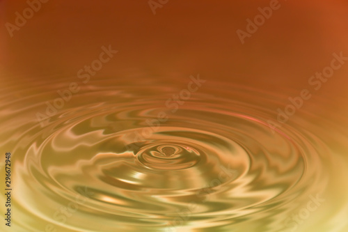 Water droplets cause the water surface to spread. Abstract images and background images