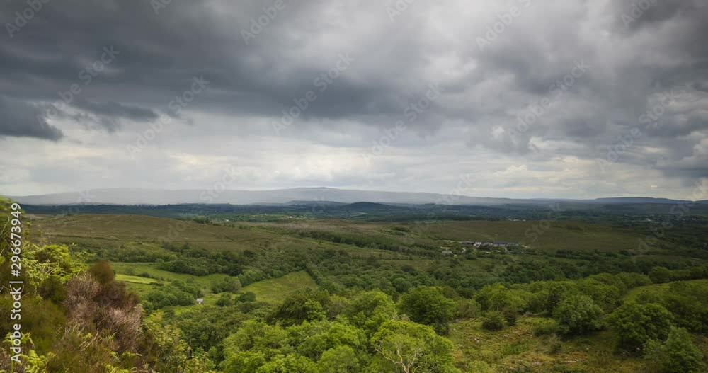 Time Lapse of nature landscape with hills and lake in the distance on a cloudy day in Ireland. Time Lapse of nature landscape with hills and lake in the distance on a cloudy day in Ireland.