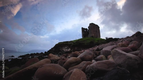 timelapse footage of the coastline in southern ireland on the dingle peninsula showing minard castle at sunset photo