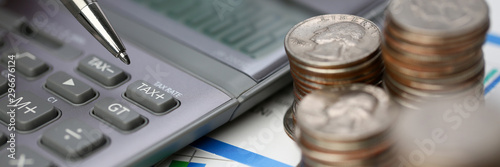 Silver calculator with gray keyboard is lying photo