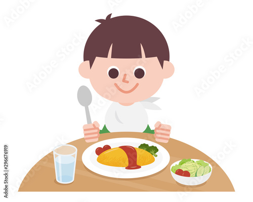 Boy eating omelet rice