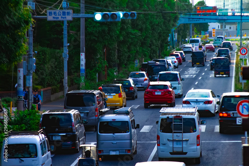 A downtown street at Kanpachi avenue in Tokyo daytime long shot photo