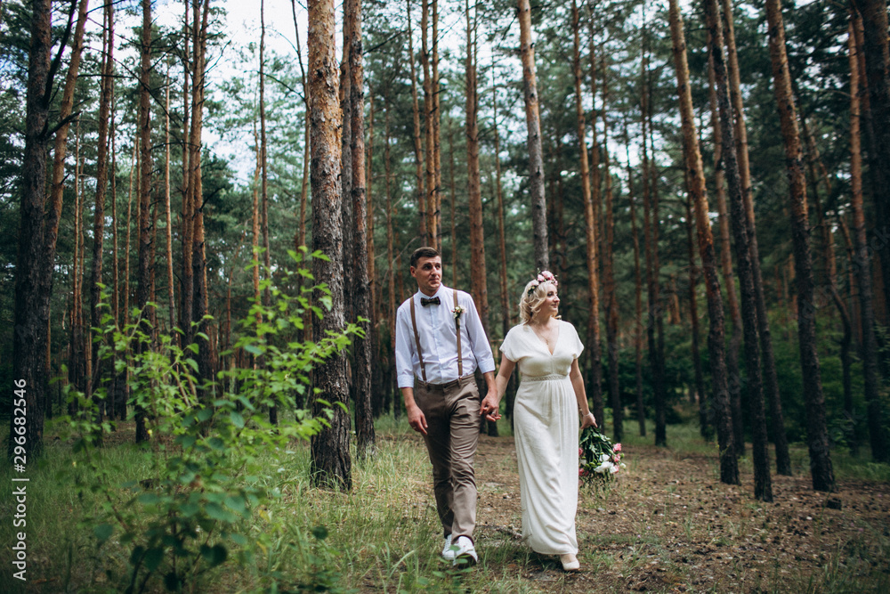Beautiful wedding couple in a forest