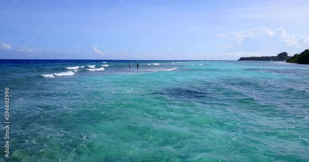 distant people in caribbean sea, still eye level shot distant people in caribbean sea, still eye level shot
