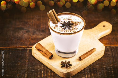 typical Christmas and winter drink, consumed at holidays. Conehcida as Egg nog, Chai Toddy, Glögi, Eierpunsch, Orchata, Coquito or egg yolk. photo