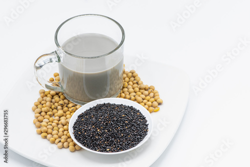 Soy milk with black sesame in glass on white background.