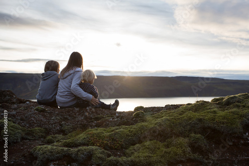 Family posing in Geothermal area in Reykjanesfolkvangur, enjoying the view of a splendid nature in Iceland