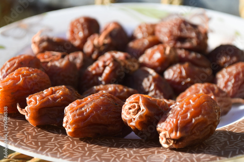close up of fresh sweet dates fruit in plate. food photography