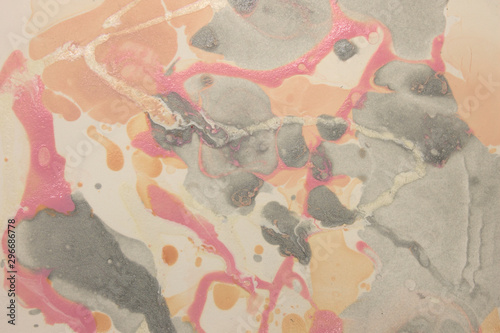 This a photograph of a Pink,White,and Gray abstract marbleized design created using nail polish